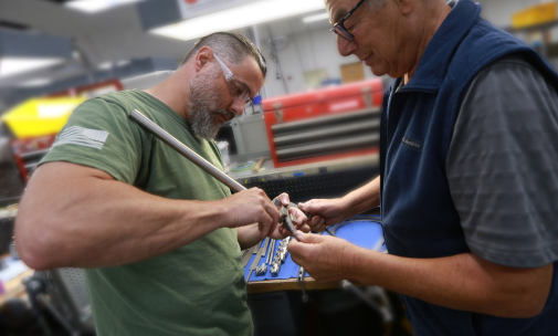 Five Star employees repairing an instrument